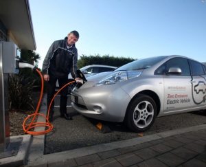 Network Tasman’s Operations Manager Robert Derks with the company’s new electric vehicle and charging station. PHOT: Tim Cuff